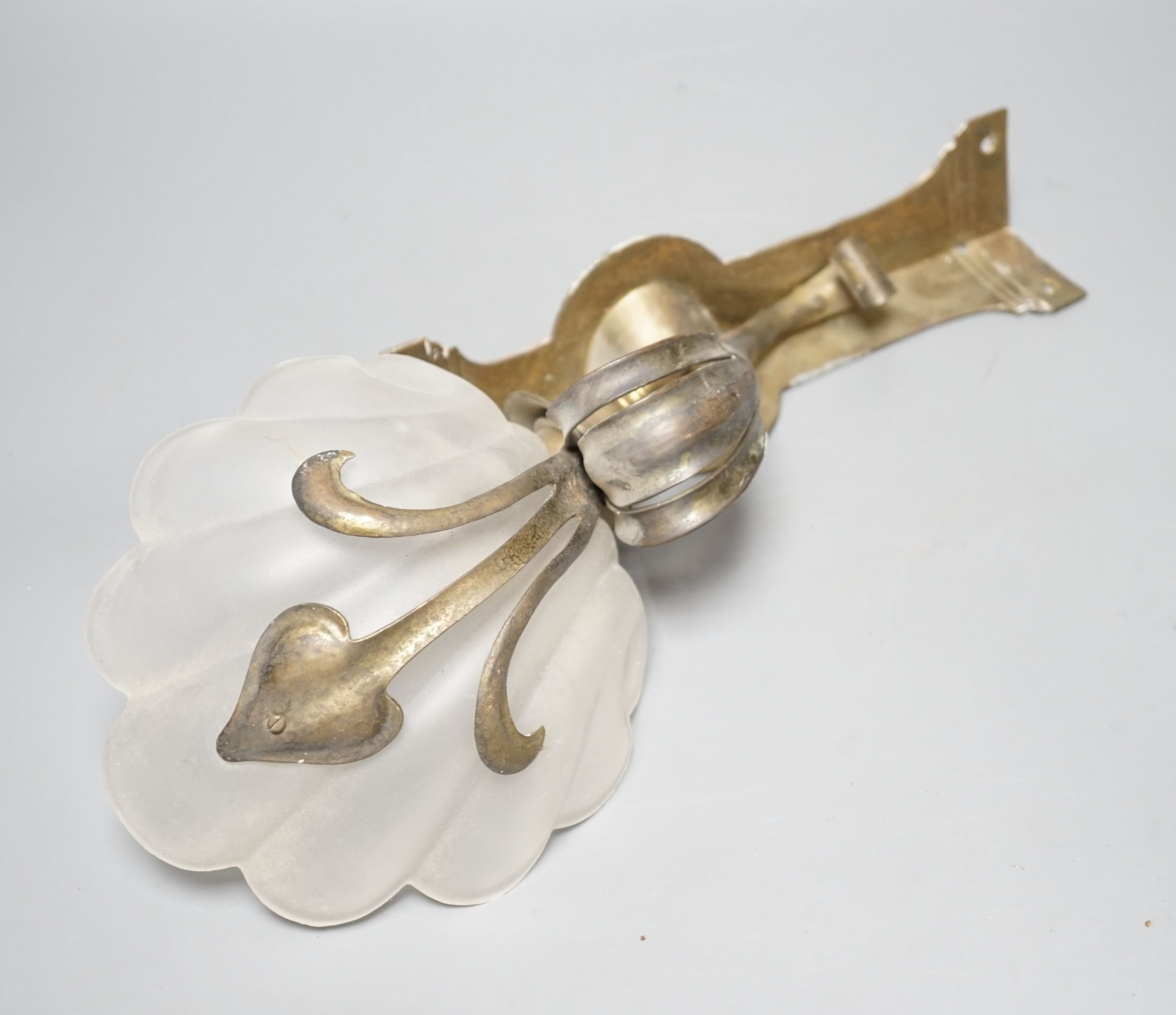 A set of five Art Nouveau style brass corner wall lights with frosted glass shades, 40 cm high